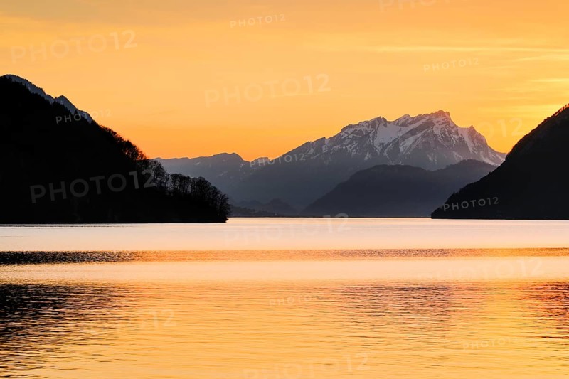 Lake with mountains in the background