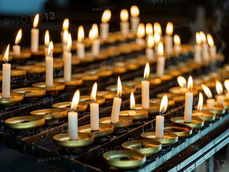 Burning sacrificial candles