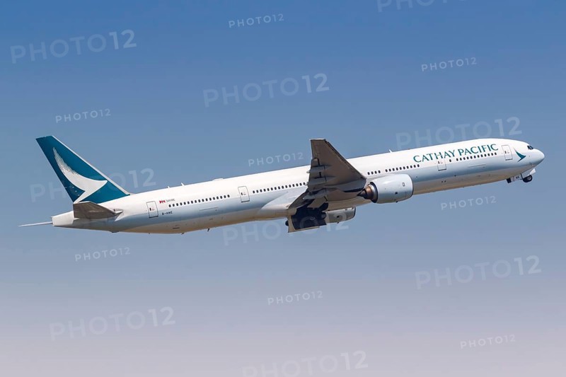 A Cathay Pacific Boeing 777-300 aircraft with registration B-HNE at Hong Kong Airport