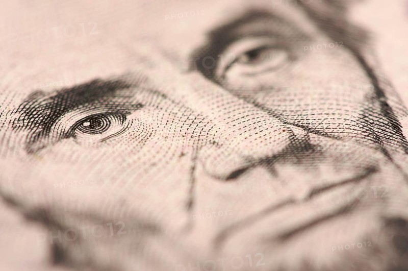 Abstract macro of U.S. five dollar bill's abraham lincoln face with narrow depth of field