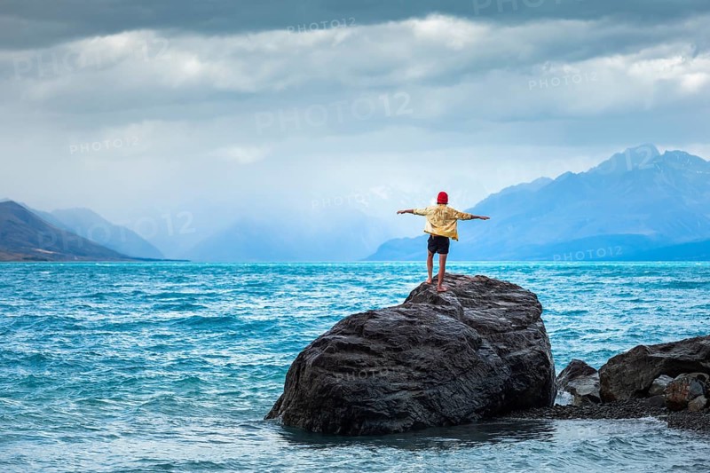 Guy at a beach at Lake Tekapo