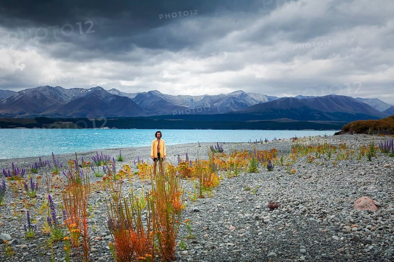 Guy at a beach at Lake Tekapo