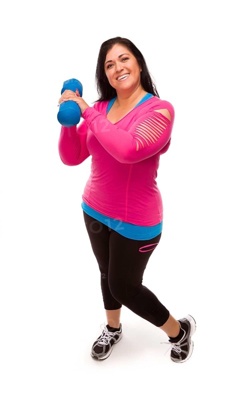 Attractive middle aged hispanic woman in workout clothes lifting dumbbell against a white background