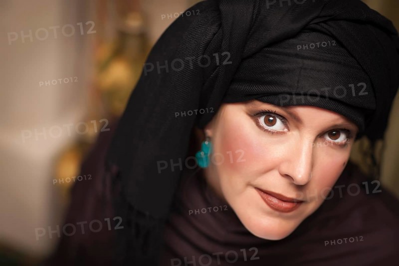Beautiful smiling islamic woman wearing traditional burqa or niqab
