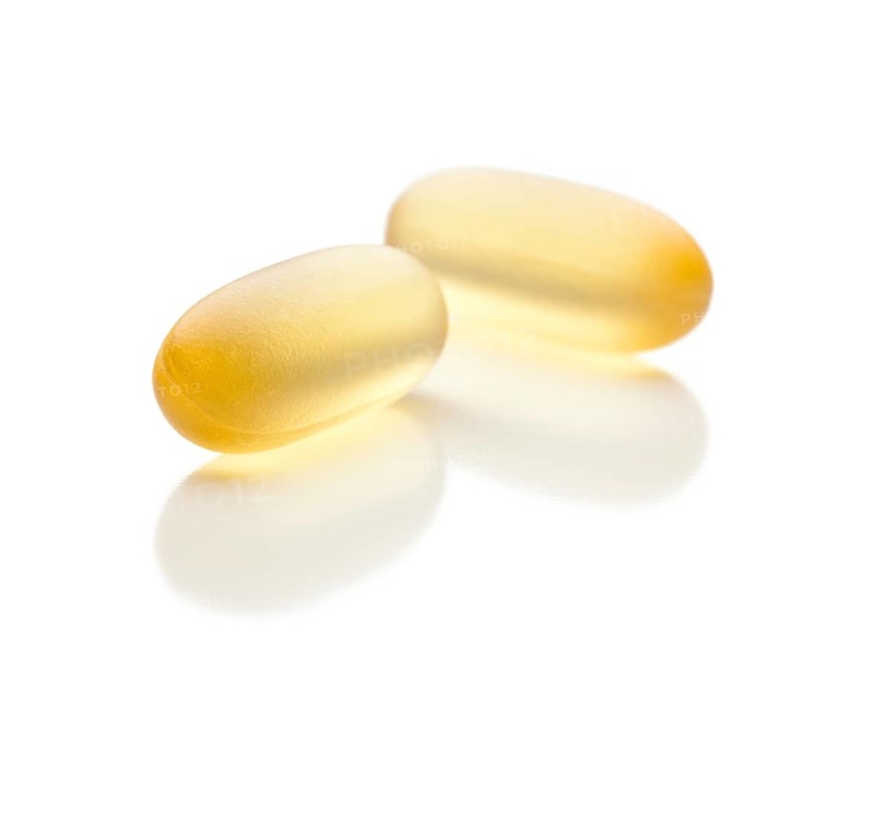 Omega 3 fish oil supplement capsules isolated on a white background