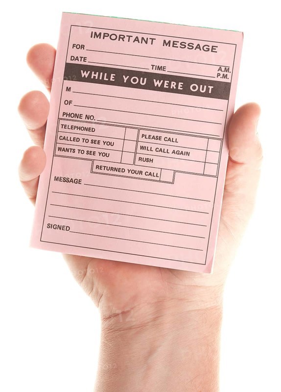 Male hand holding blank pink message pad isolated on a white background