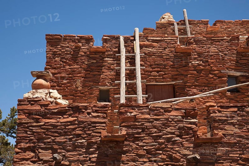 Southwestern hopi house 1905 architecture abstract with wooden ladders and clear blue sky