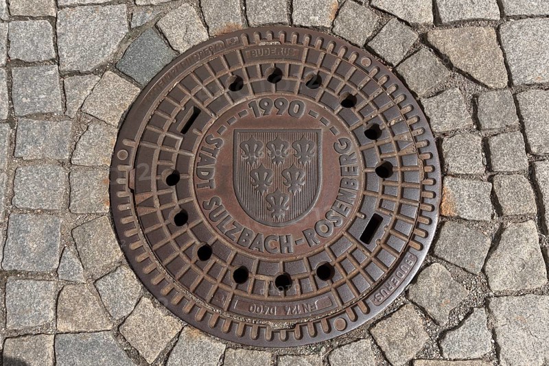 Manhole cover with city coat of arms