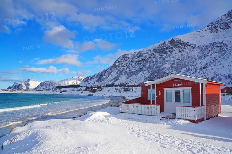 Red cottage in winter