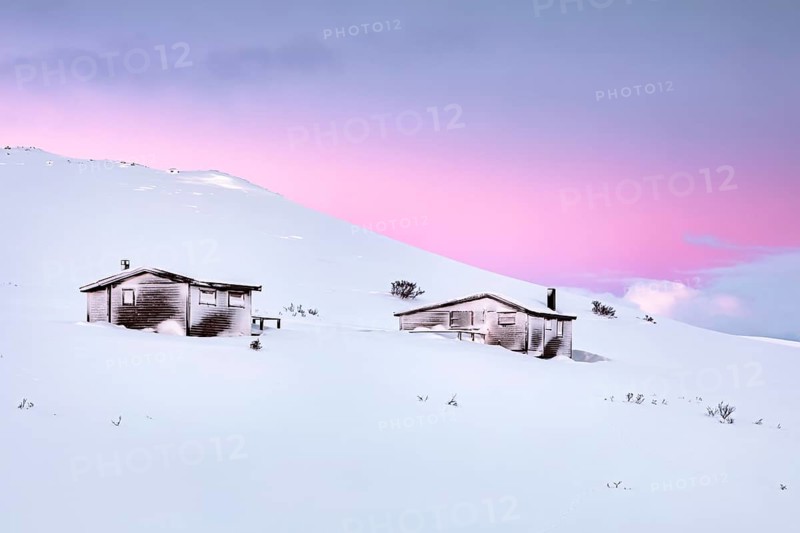 Cabins in winter landscape
