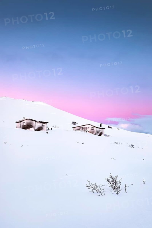 Cabins in winter landscape