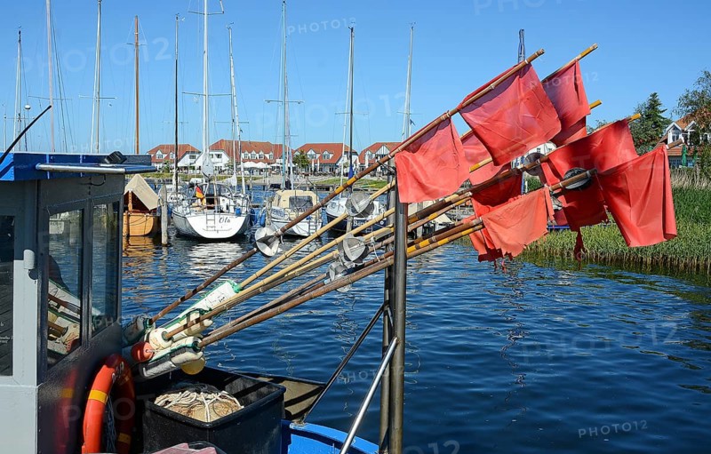 Red fishing flags at the seaside resort of Rerk