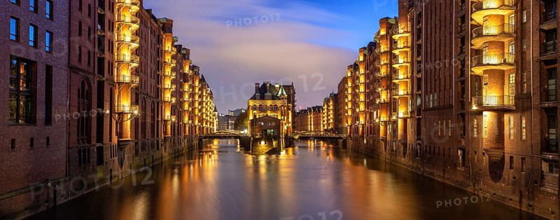 Moated castle Speicherstadt castle panorama at night in Hamburg