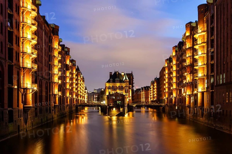 Moated castle Speicherstadt castle by night in Hamburg
