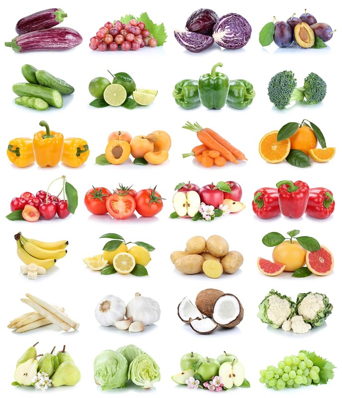 Fruits and vegetables fruits apple tomatoes bananas oranges lemon grapes colors collage cropped isolated against a white background in Germany