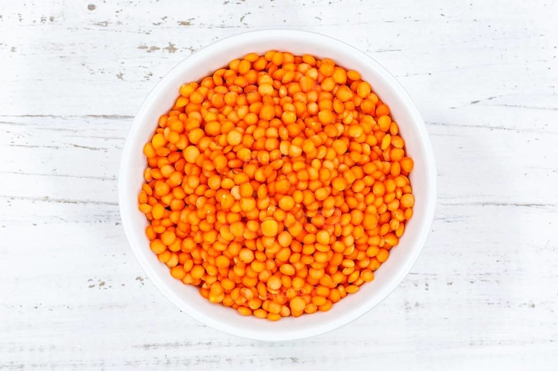 Red lentils raw from top wooden board in Germany