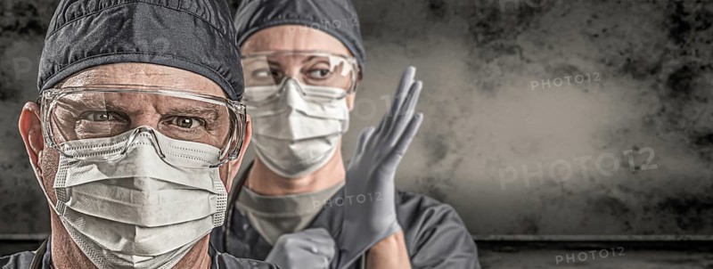 Female and male doctors or nurses wearing scrubs and protective mask and goggles banner