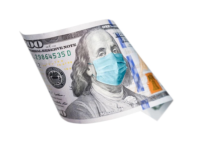 One hundred dollar bill with medical face mask on benjamin franklin isolated on white