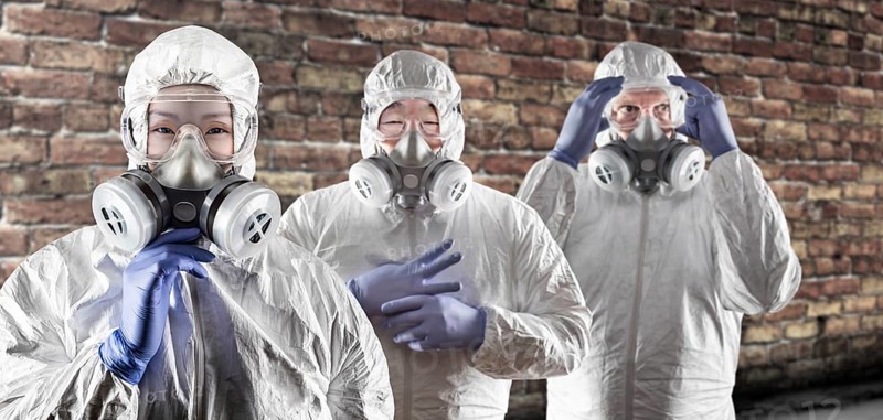 Chinese and caucasian woman and men in gas masks