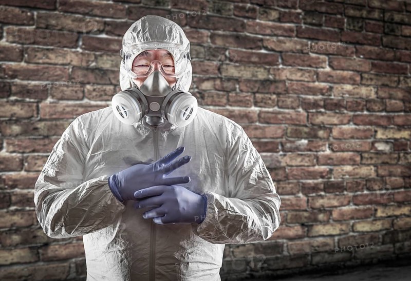 Chinese man wearing hazmat suit