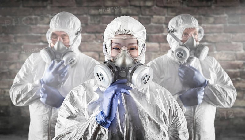 Chinese woman and team behind in hazmat suites