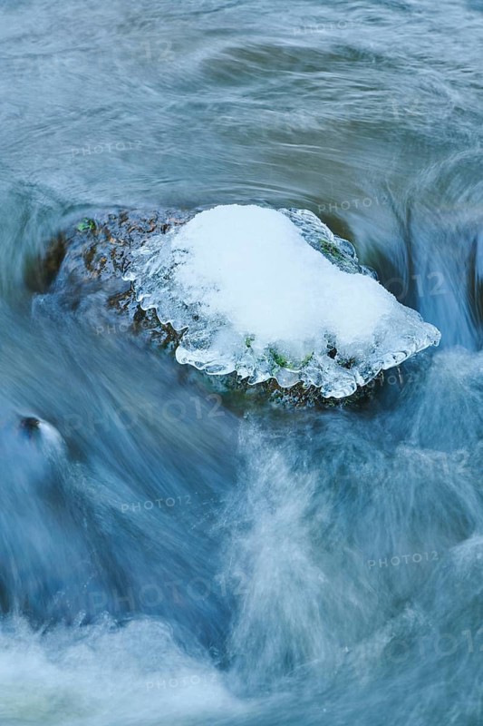 Icicles on wild river in nature reserve Hoelle