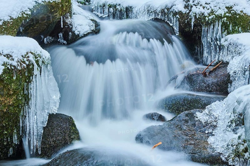 Icicles on wild river in nature reserve Hoelle