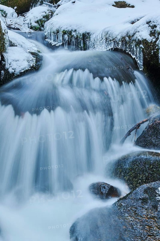 Icicles on wild river in nature reserve Hoelle