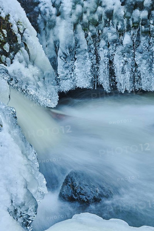 Icicles on the bank of the torrent Hoellbach