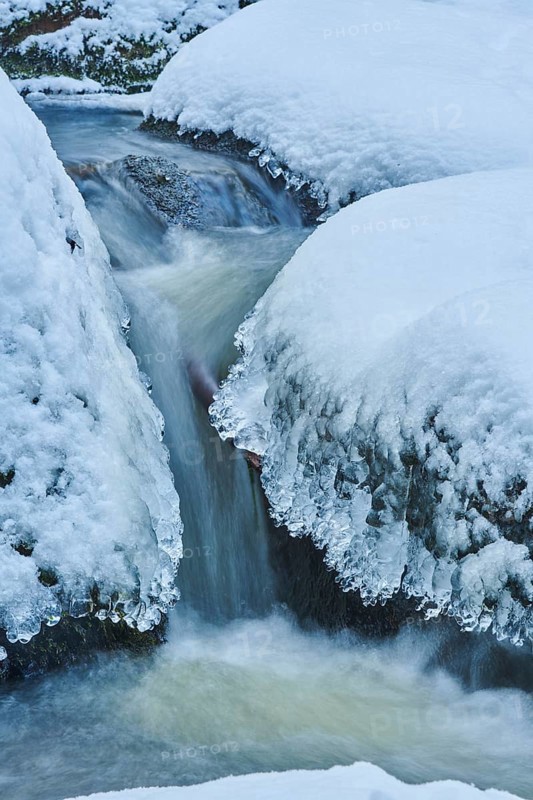 Icicles on the bank of the torrent Hoellbach