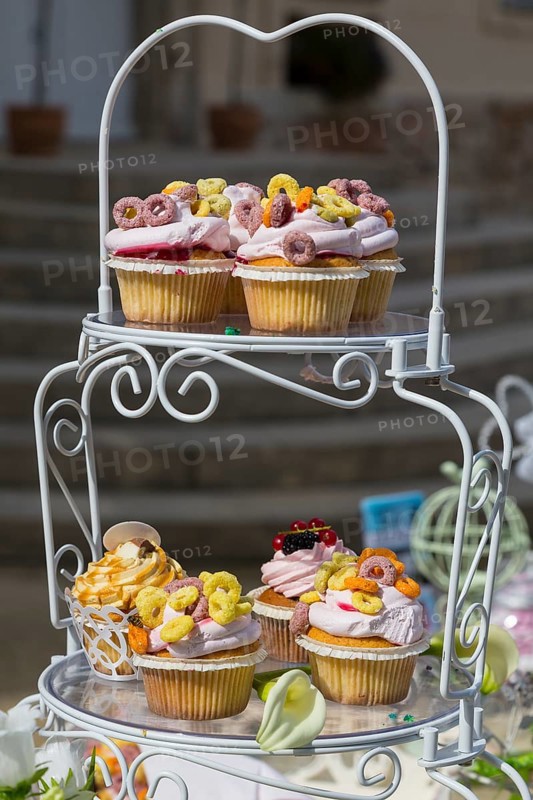 Vintage etagere with cupcakes on a candy bar
