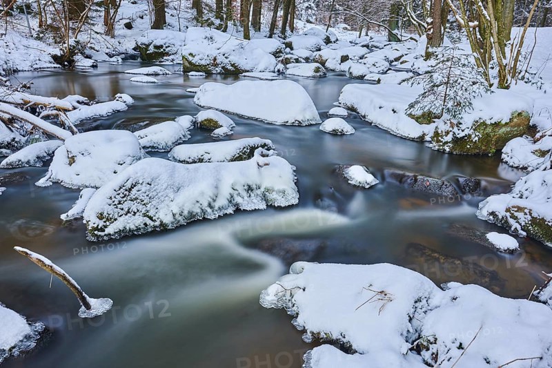 Wild river Hoellbach flows through in winter
