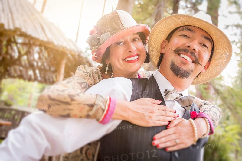 Attractive 1920s dressed romantic couple flirting outdoors