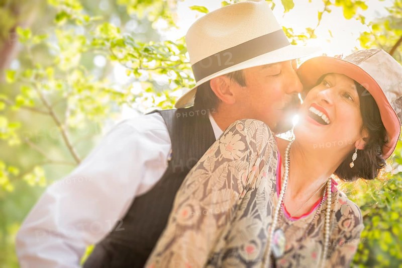 Attractive 1920s dressed romantic couple flirting outdoors