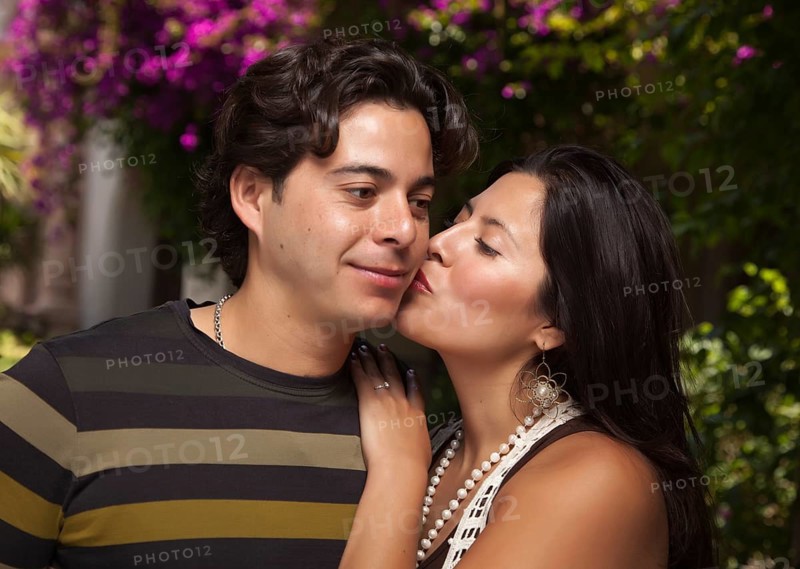 Happy attractive hispanic couple enjoying themselves at the park