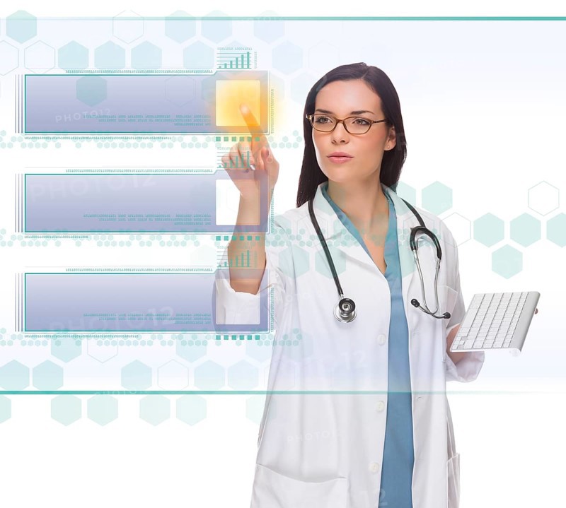 Female doctor or nurse holding wireless keyboard pushing blank button on futuristic translucent panel