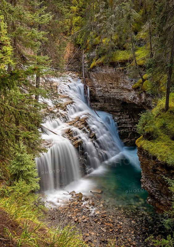 Waterfall flowing in cascades