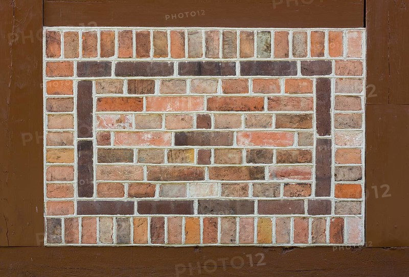 Pointing stones as patterns on the church wall in half-timbering
