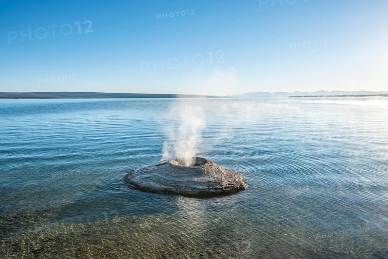 Steaming fumarole in lake