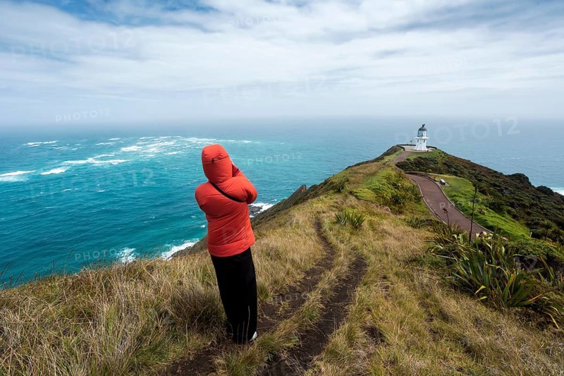Guy infront of Cape Reinga Lighthouse