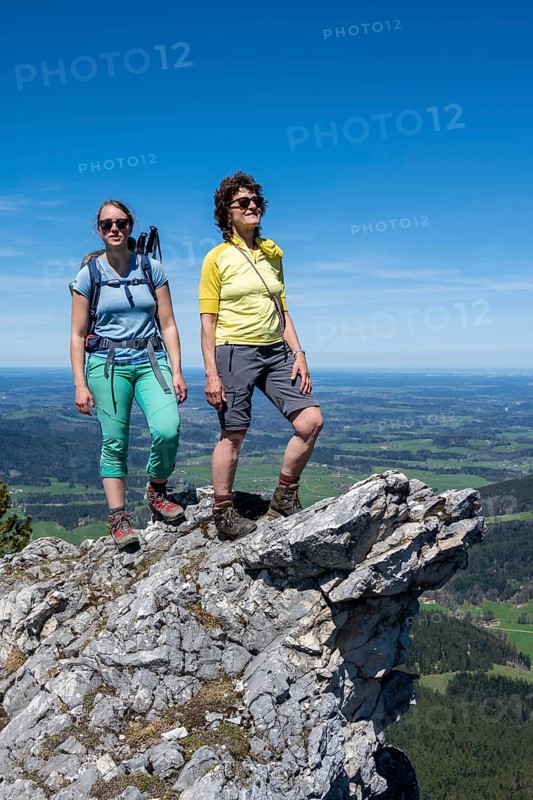 Two female hikers looking over the alpine foothills