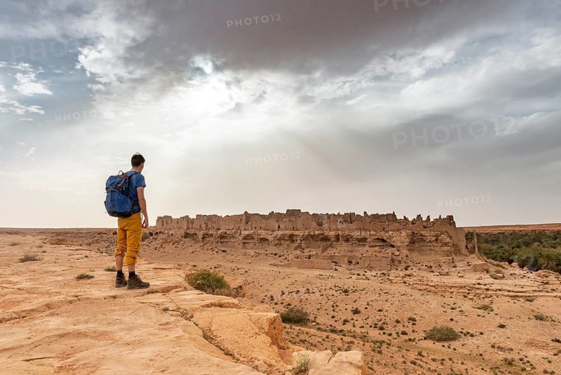 Young man at a cliff edge