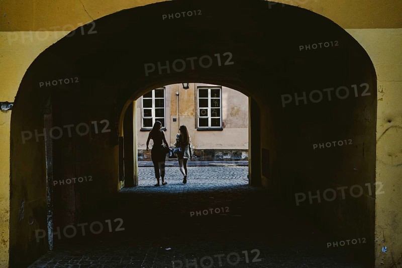 Girls coming out of the yard gate