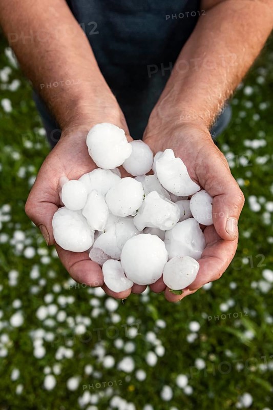 Golfball-sized hailstones in hands
