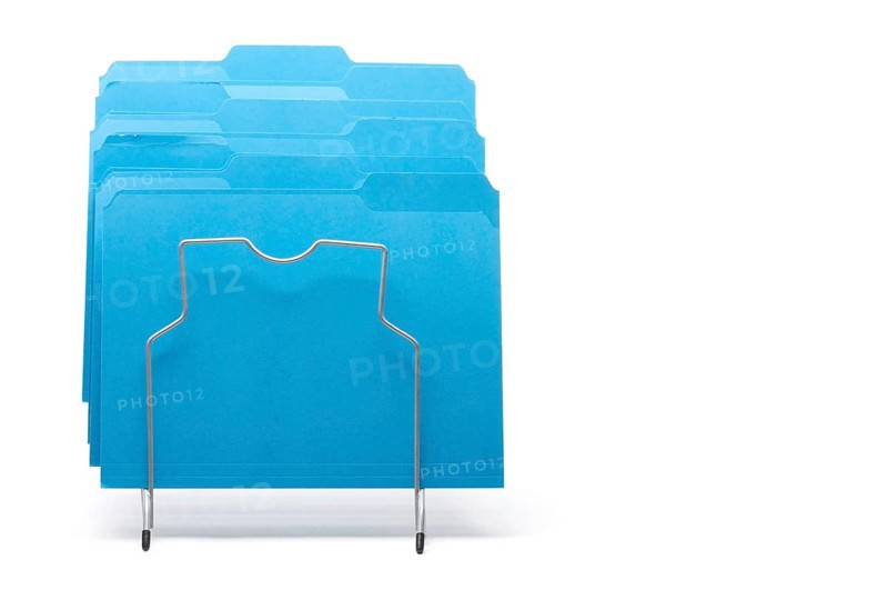 Blue file folders in rack isolated on a white background. labels ready for your own text
