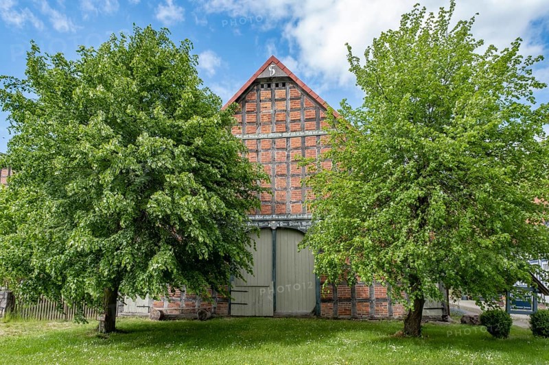 Half-timbered house in the round village of Satemin