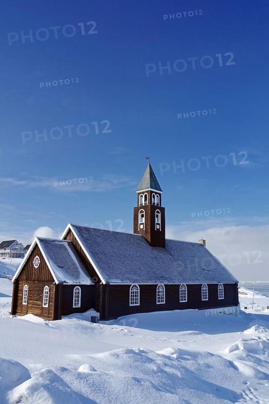 Wooden church in winter landscape