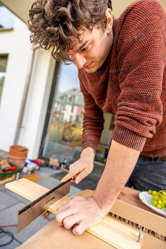 Young man doing DIY in his apartment
