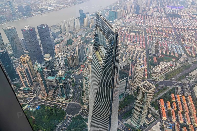 View from the highest observatory of the world on 562 meters height in the 632 meters high skyscraper Shanghai Tower to the special economic zone Pudong with the 492 meters high Shanghai World Financial Center