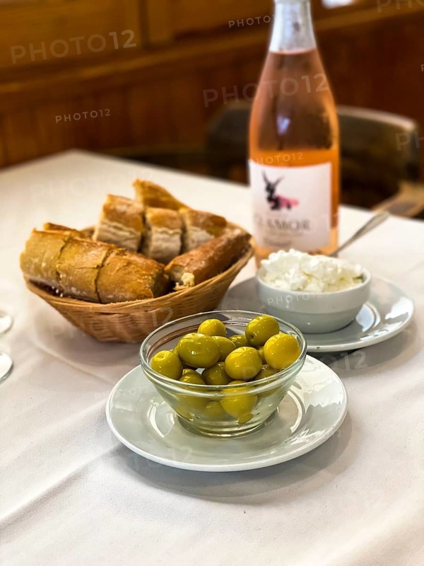 Olives with white bread and wine